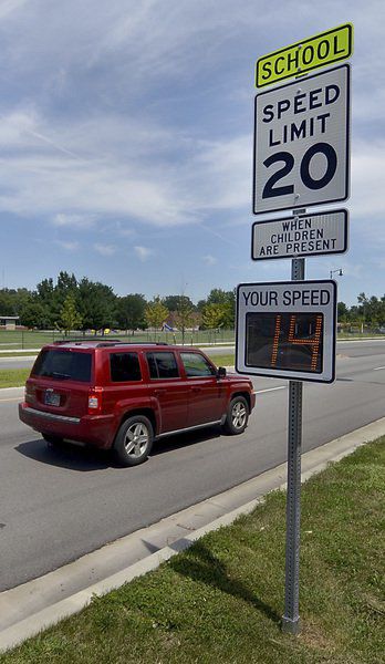 As kids return, crossing guards take up job they love